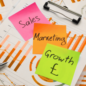 Sales, marketing, and growth concept with colourful sticky notes on financial charts and graphs – representing results-driven food & drink marketing.