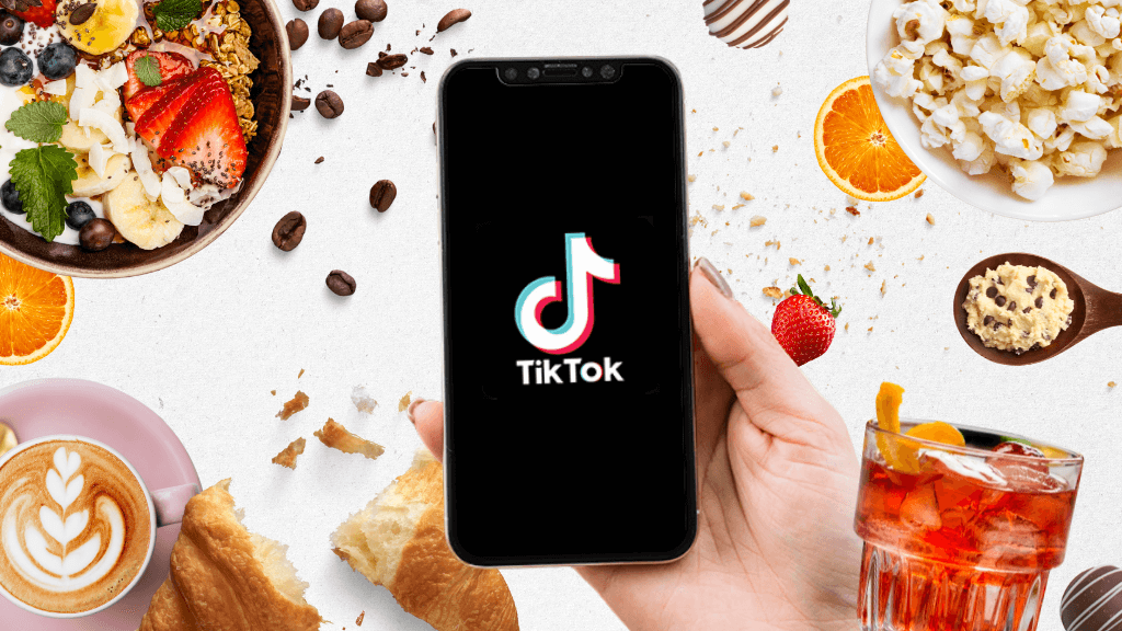 “Food brand founder filming TikTok video in a kitchen showing behind-the-scenes product prep – representing TikTok marketing for food and drink brands in 2025.”