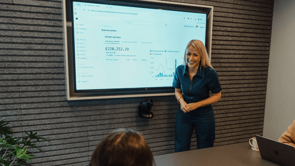 Kate Williams presenting Klaviyo email marketing revenue data during a food and drink marketing strategy session.